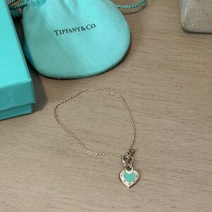Tiffany & Co. Silver Heart Bracelet with Blue Charm
